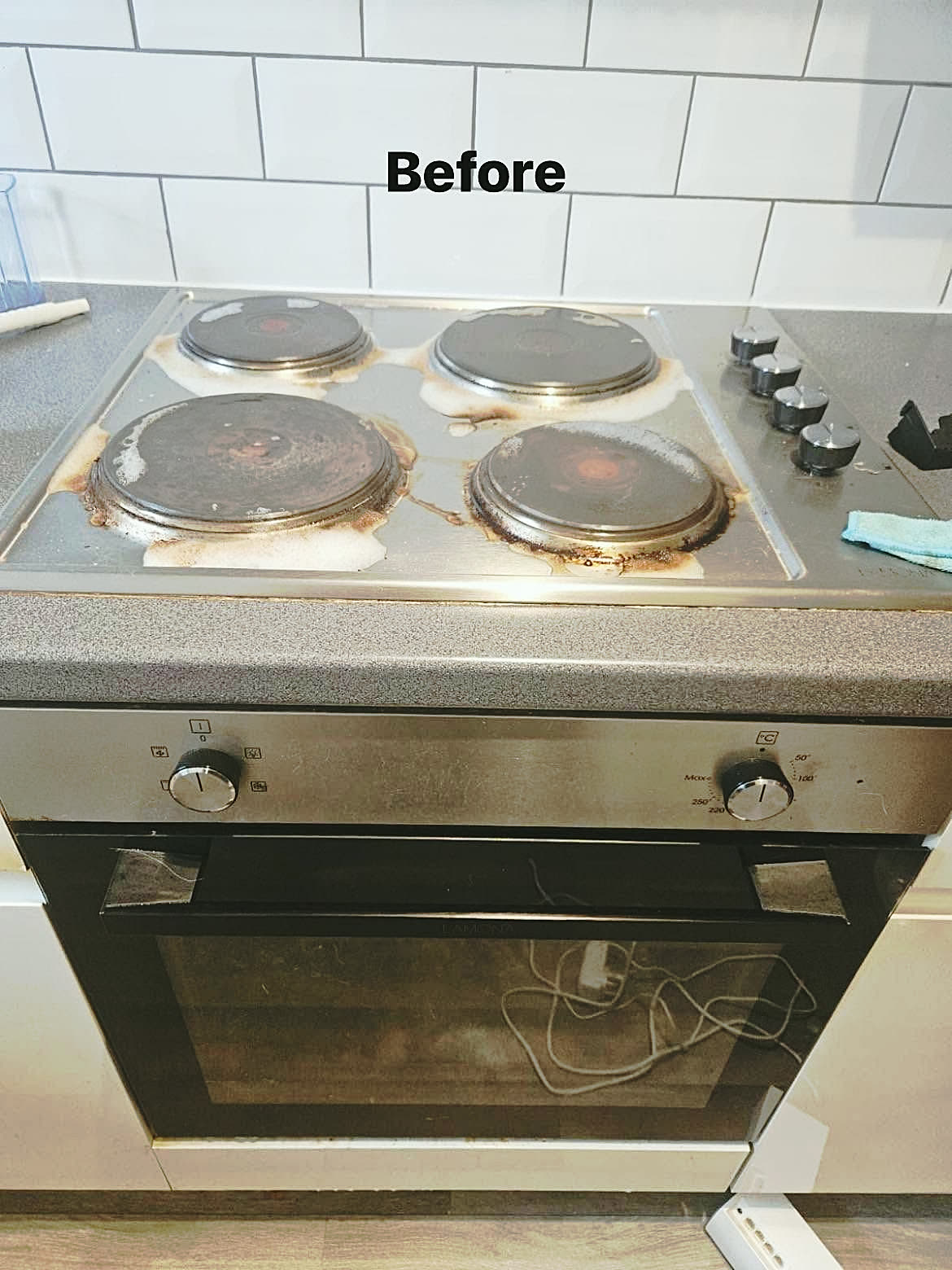 Before: Electric hob and oven front after cleaning