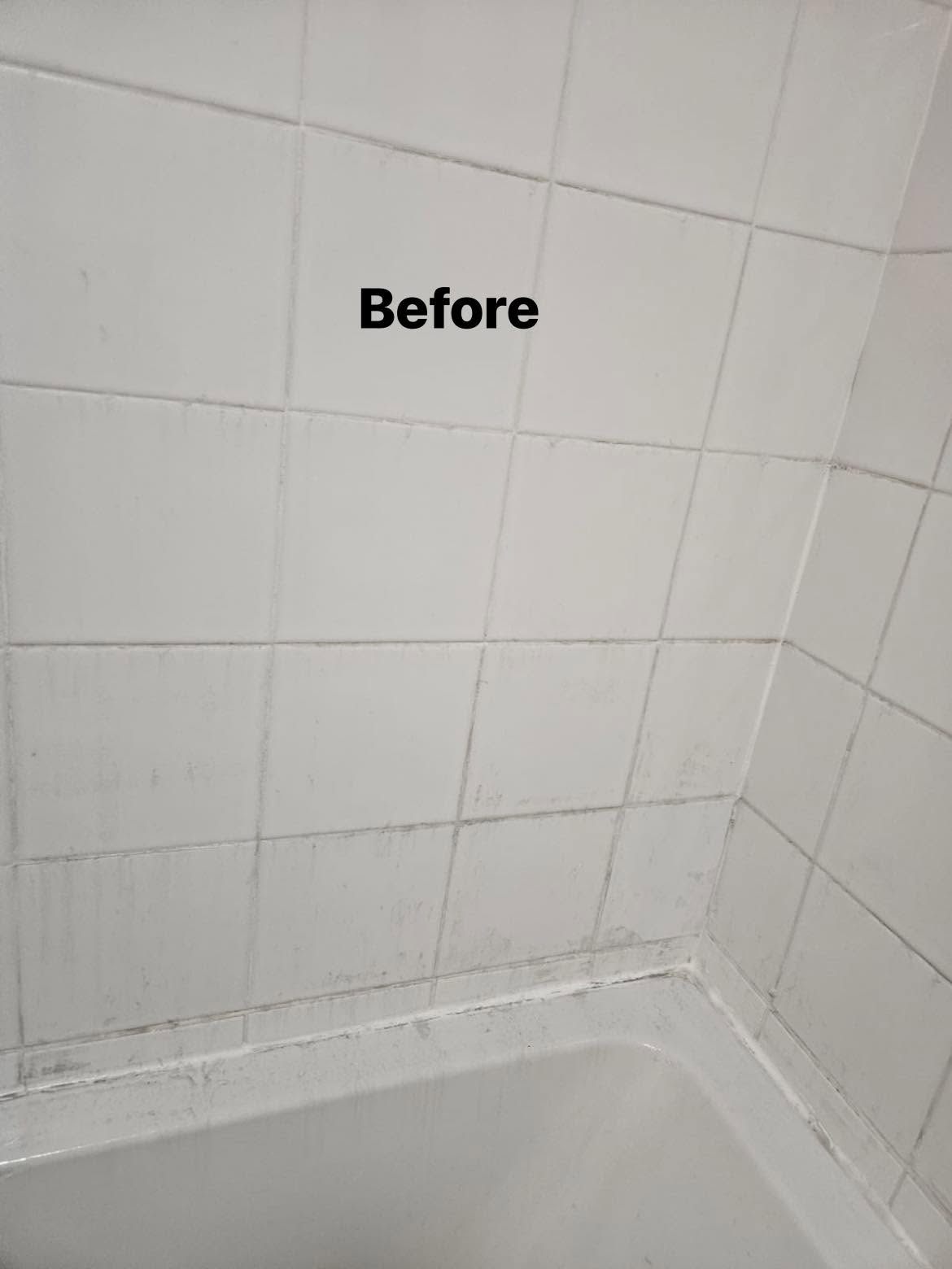Before: White bath and tiled wall after cleaning