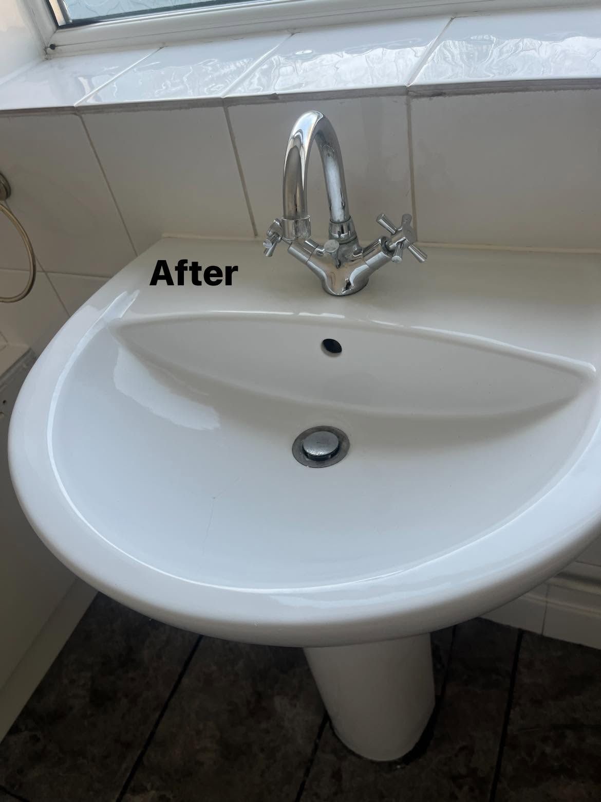 After: White pedestal sink with mixer tap after cleaning